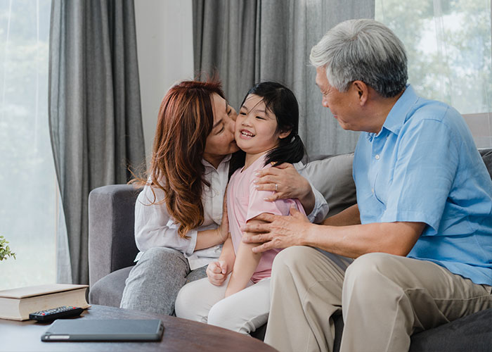 Professional advisor reviewing charts, policy documents, or retirement planning paperwork with a client.